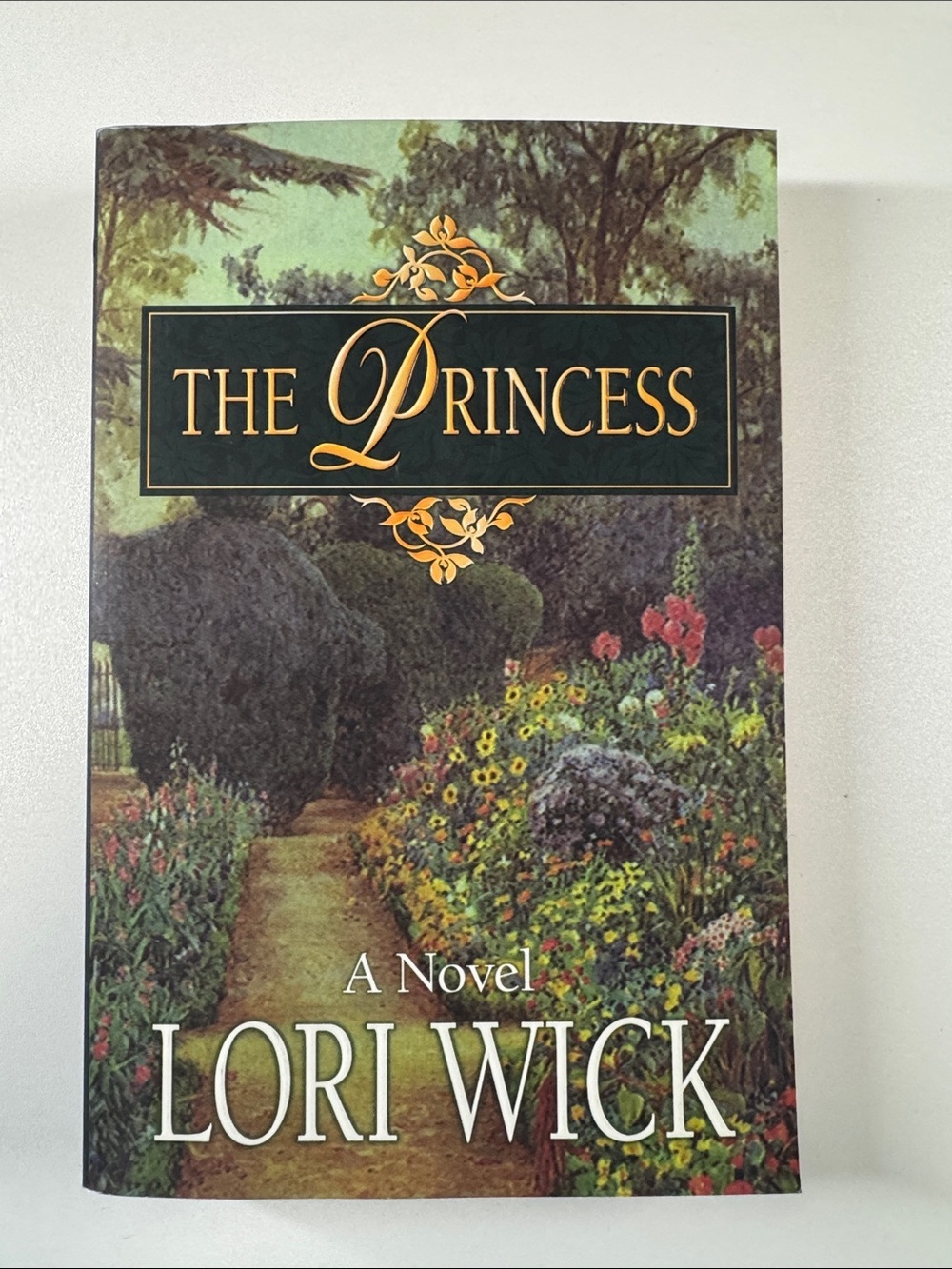 Lori Wick "The Princess" Hardcover-Style Novel - Green Floral Cover